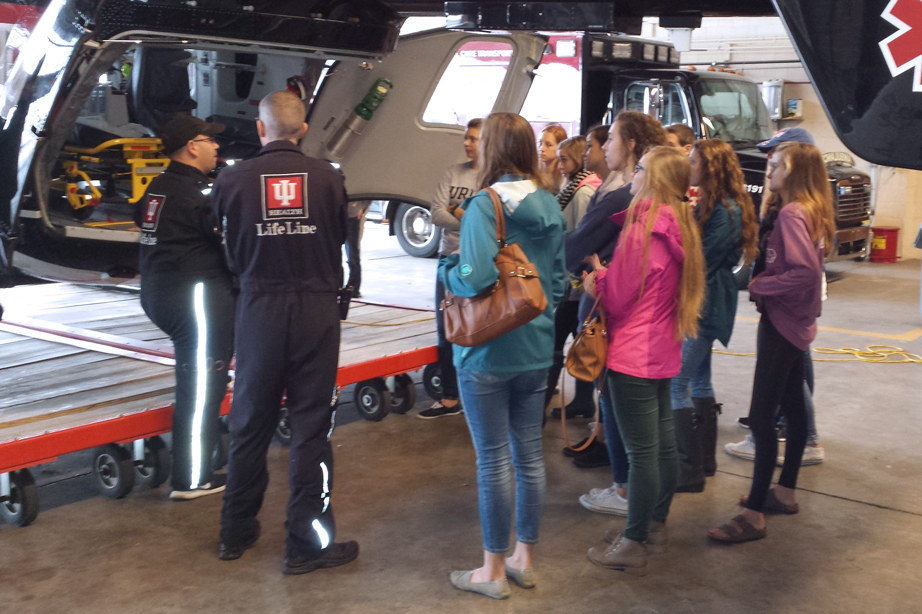 Students touring a helicopter